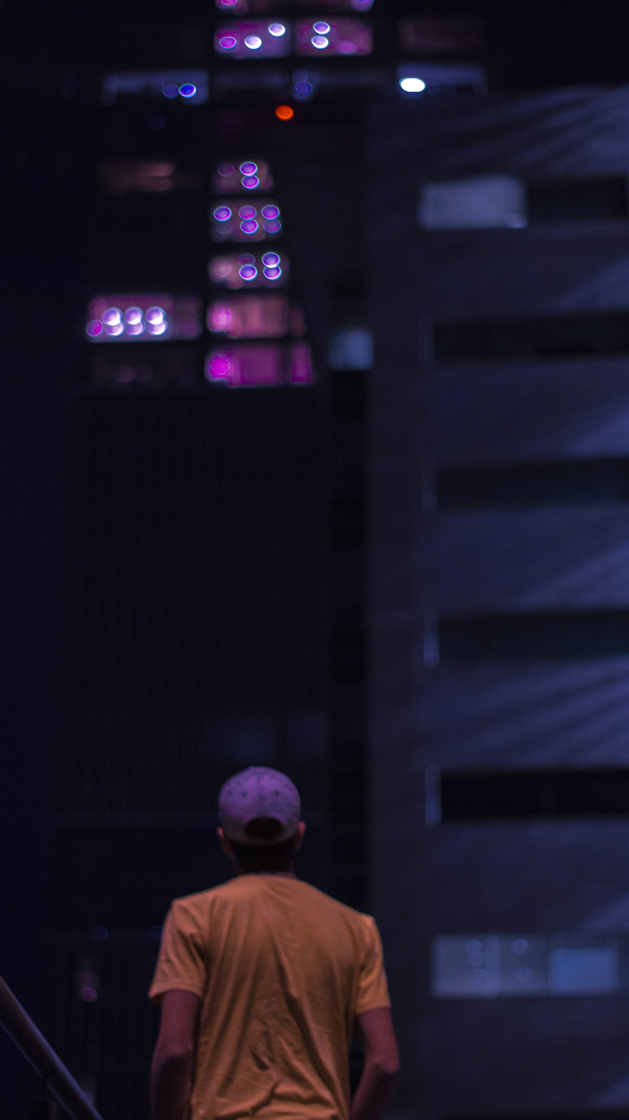 standing man wearing brown t-shirt