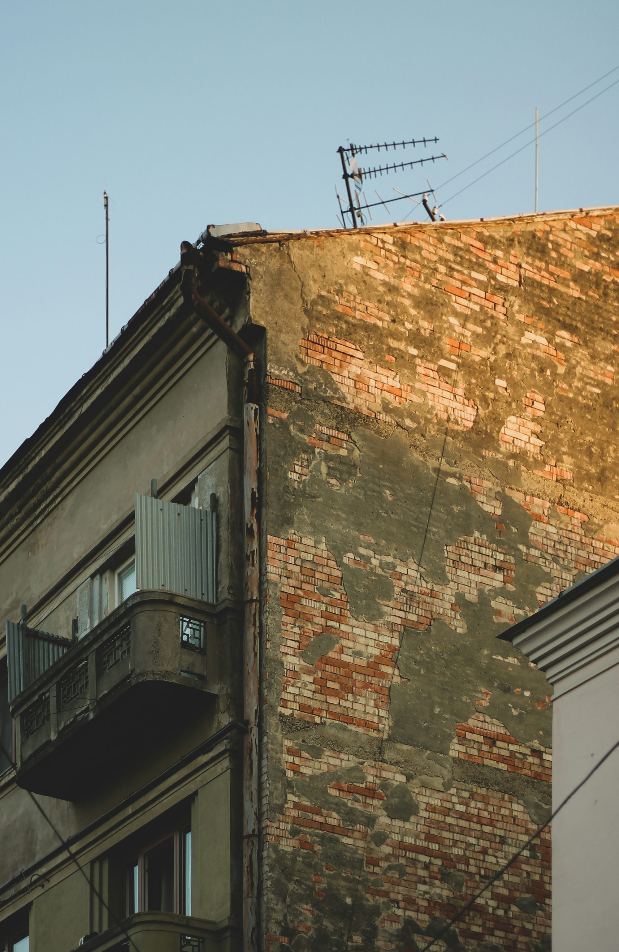 brown brick building under blue sky during daytime