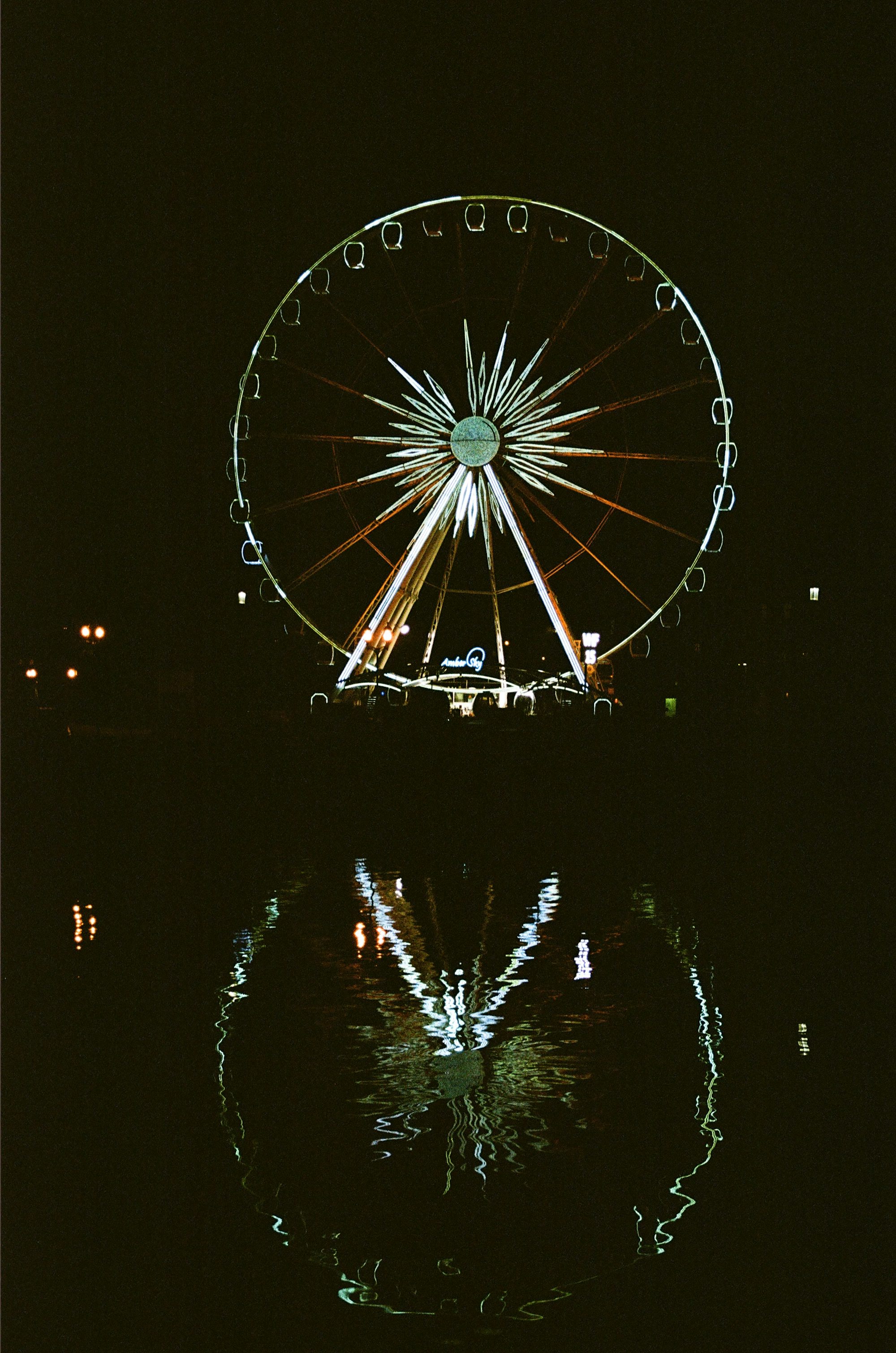 white and blue ferris wheel